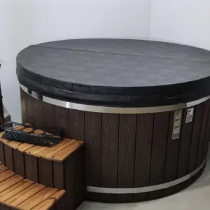 Classic round hot tub with an external stove